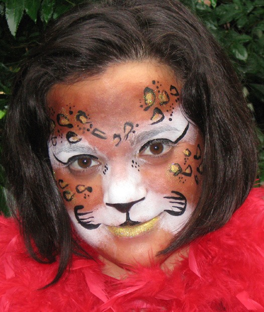 Child with face paint resembling a leopard